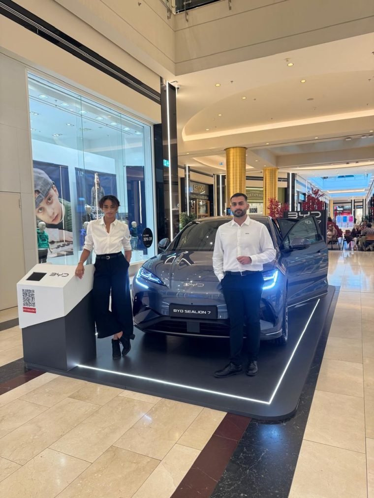 A BYD in-store promotion in a dealership showroom.