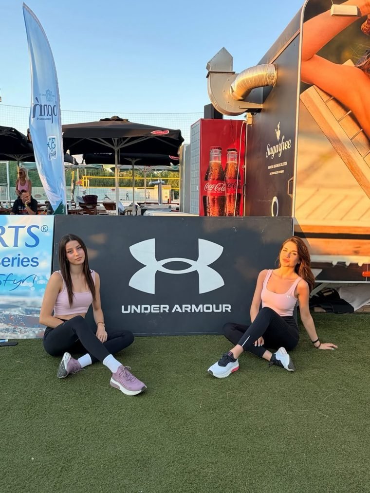 An outdoor brand activation with a staffed touchpoint.
