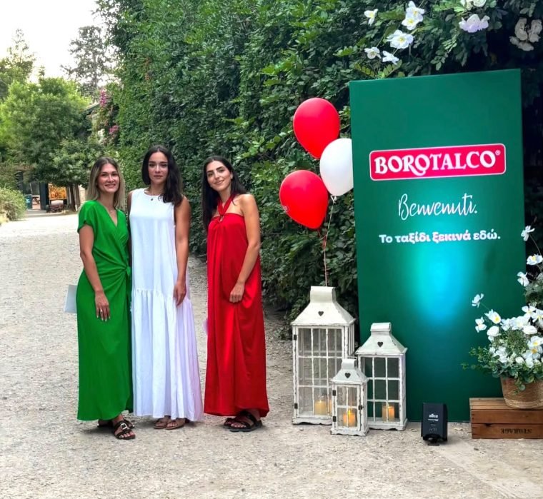 Promoters at an outdoor Borotalco event, in front of a branded backdrop.