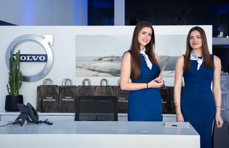 Two hostesses at the Volvo reception desk.